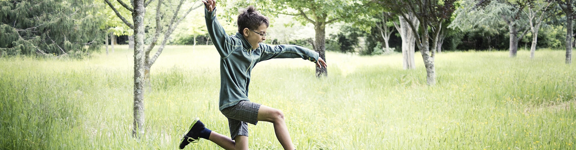 Child running on a meadow