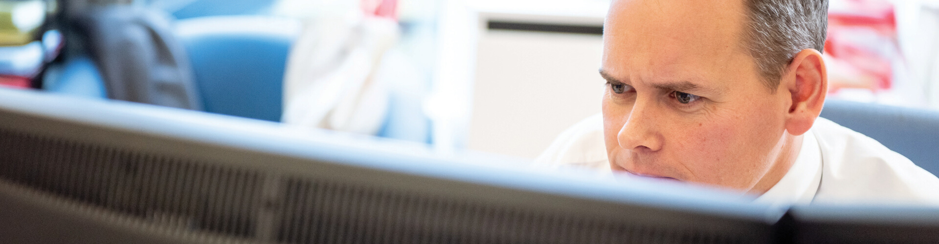 Man looking at a computer monitor
