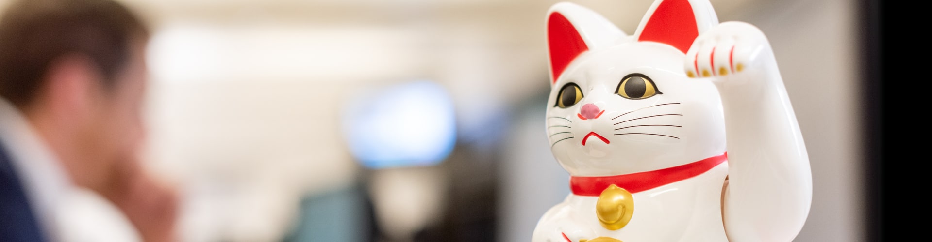 White lucky waving cat figurine