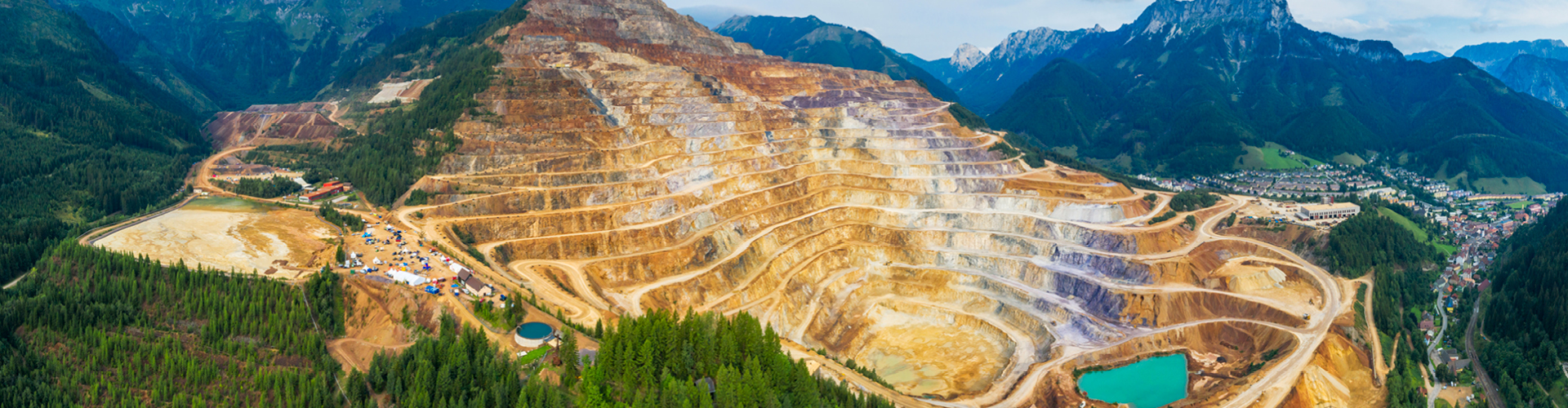 Bird's-eye view of a mine surrounded by forest