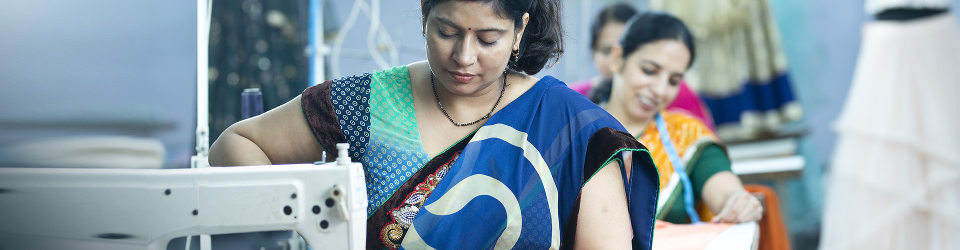 Factory worker at sewing machine