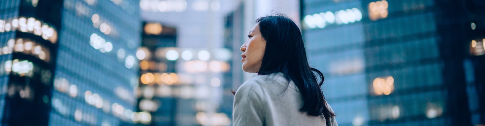 Woman stood in City landscape