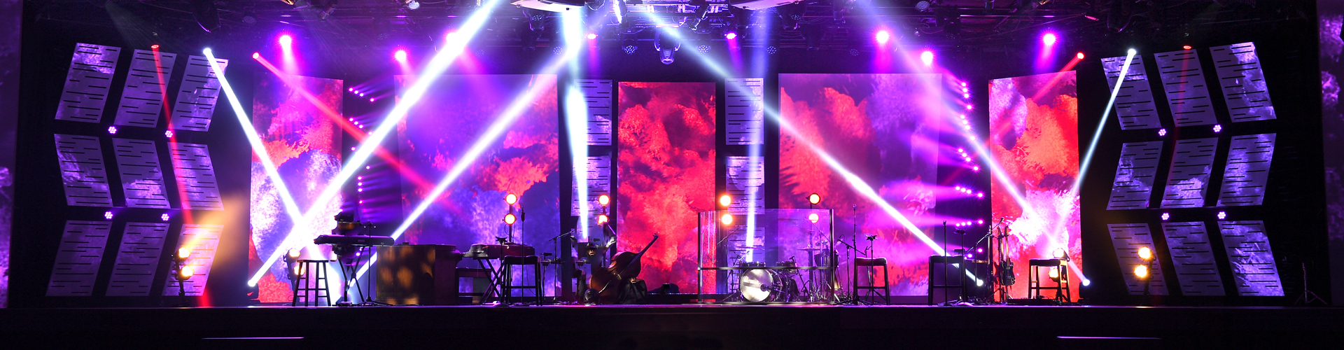 Musical instruments on colourfully lit stage