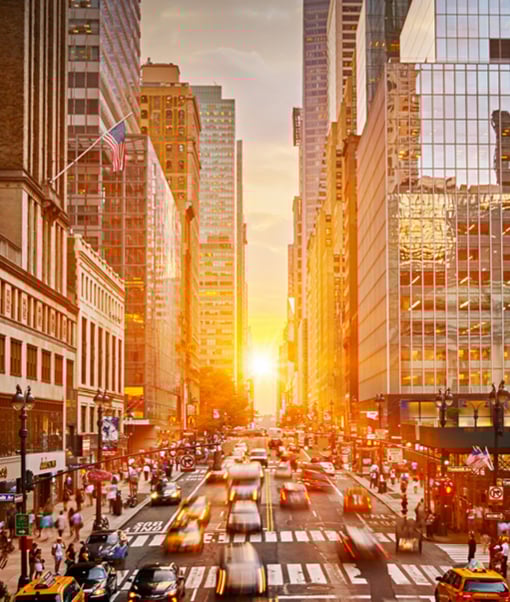 American city street with traffic at sunrise