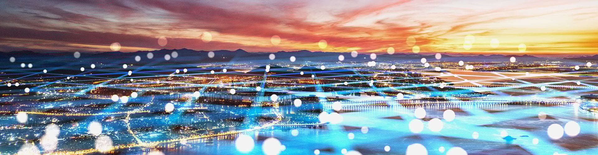 View over waterfront city at sunset