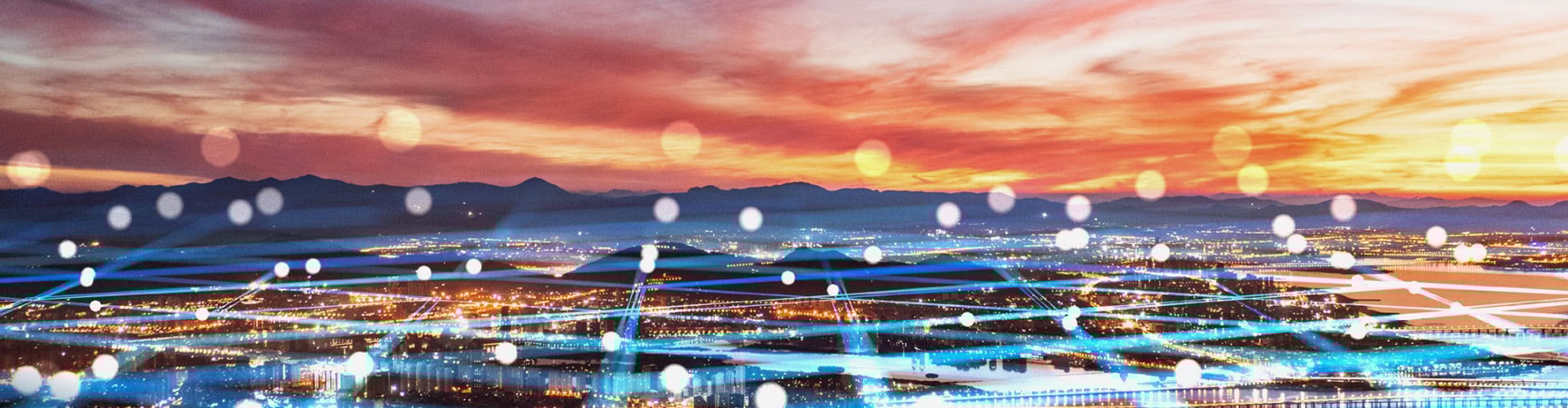 View over waterfront city at sunset