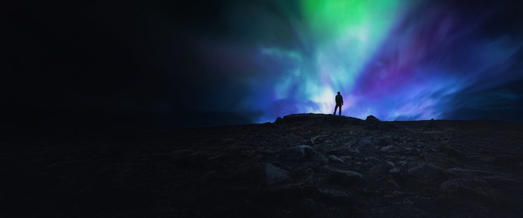 Person looking at Northern Lights/Aurora Borealis