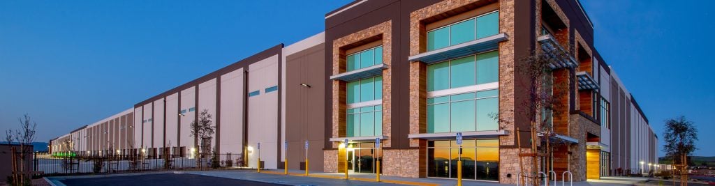 Artist's impression of commercial property against evening sky