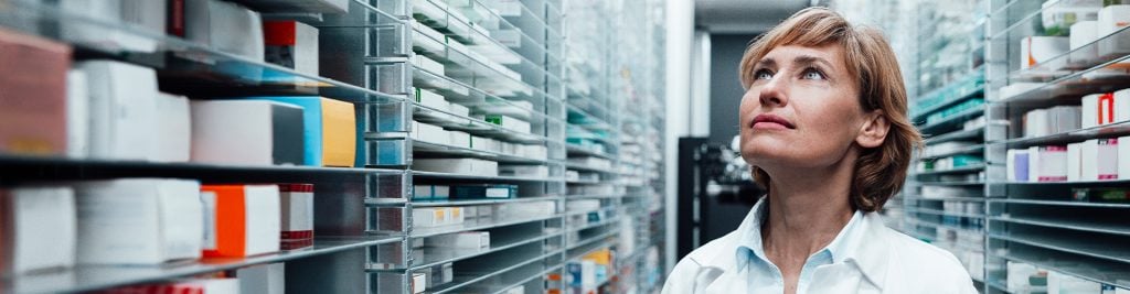 2825598 Pharmacist searching for medicines at the drugstore