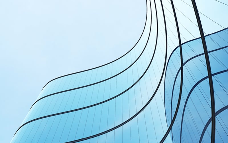 View looking up to a glass office building