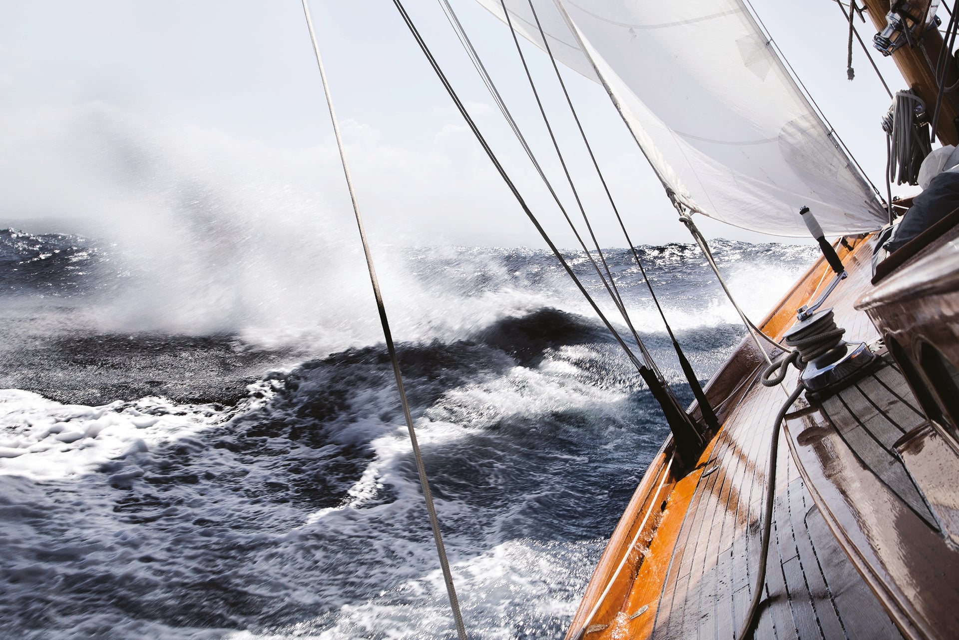Sail boat on stormy seas
