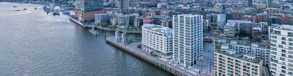 Bird's-eye view of real estate buildings in waterfront city