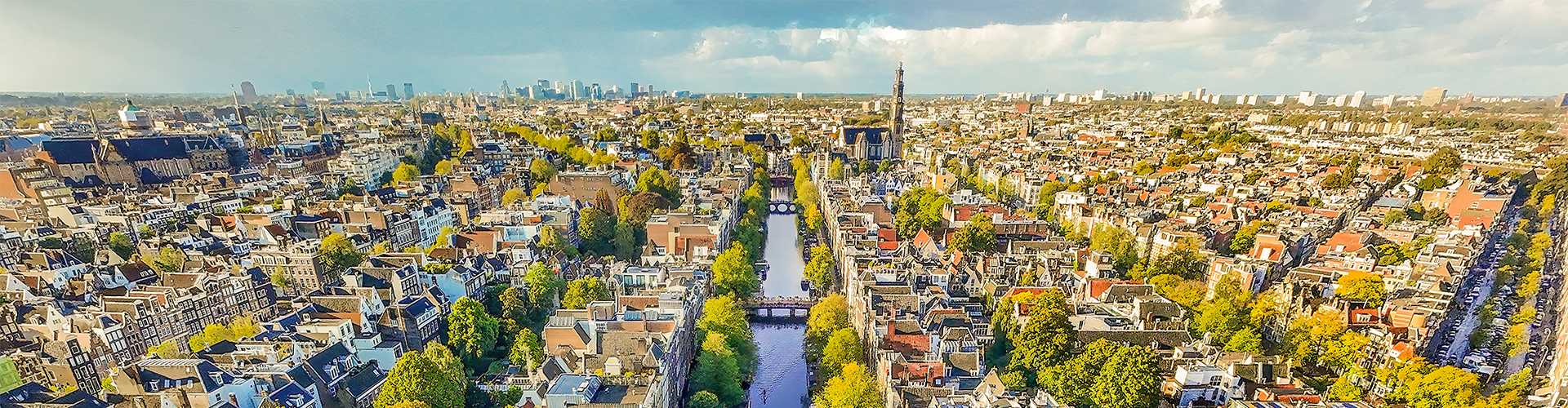 Aerial view of the buildings, water and bridges in Amsterdam on a sunny day