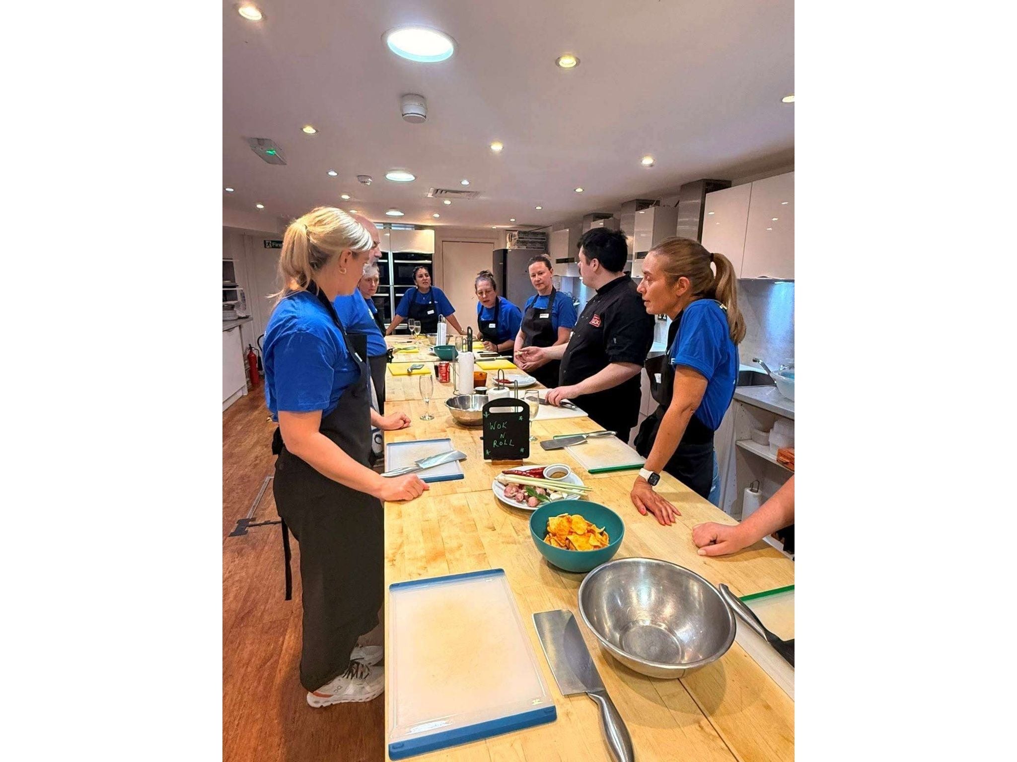 Group of employees from Columbia Threadneedle Investments taking part in a cooking class
