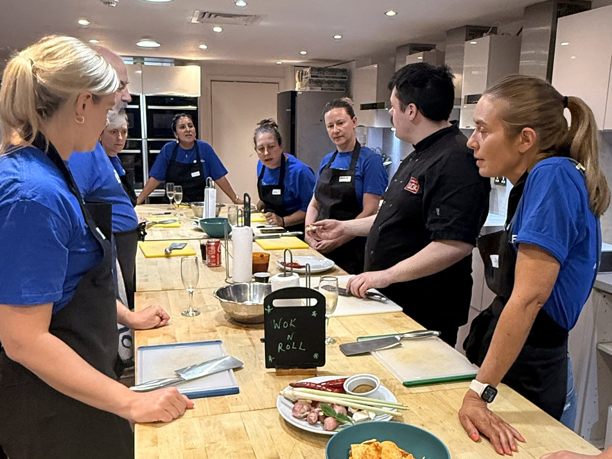 Group of employees from Columbia Threadneedle Investments taking part in a cooking class