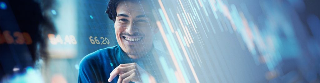 Man smiling with investment charts in the background