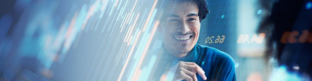 Man smiling with investment charts in the background